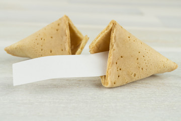 fortune cookie with blank label, wooden background