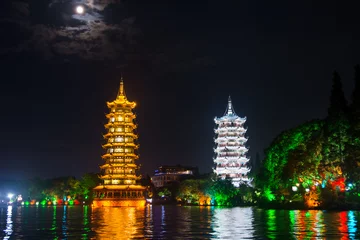 Foto op Plexiglas Two towers in Guilin in China with moonlight sky © creativefamily