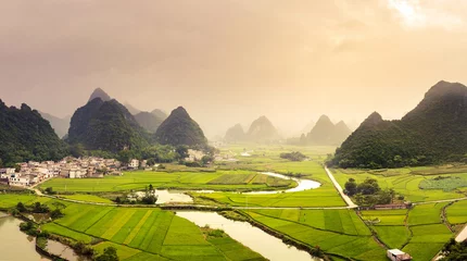 Fototapeten Stunning rice fields and karst formations scenery in Guangxi pro © creativefamily
