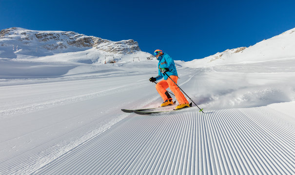 Young man skiing downhill in Alps