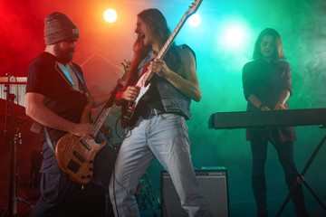 Fototapeta premium Guitarist and bass player perform on stage.