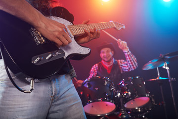 Obraz premium Guitarist and bass player perform on stage.