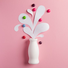 Yogurt bottle with splashes and vitamins
