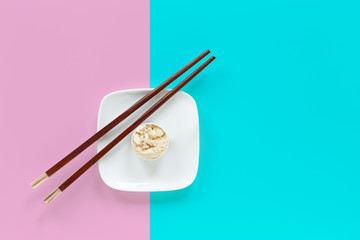 Fototapeta na wymiar Protein powder in scoop on small plate with chopsticks