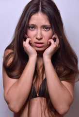 Fototapeta premium Sexy woman in leather jacket and panties with stage make up.
