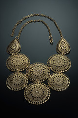 Necklace on black studio background