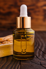 frankincense essential oil on a wooden background