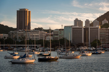 Fototapeta premium Skyline of Rio de Janeiro by Sunset with Boats in Guanabara Bay