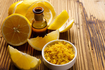 Lemon essential oil on a wooden background