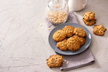 Healthy oatmeal cookies, vegan and vegetarian sweets, homemade baked biscuits for dessert with oats copy space