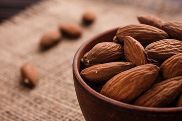almond essential oil on a wooden background