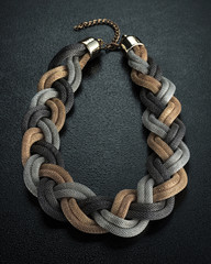 Necklace on black studio background