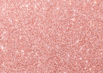 Fototapeta premium Rose gold pink background glitter texture sparkling shiny wrapping paper for Christmas holiday seasonal wallpaper decoration, greeting and wedding invitation card design element
