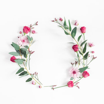 Flowers composition. Wreath made of various pink flowers and eucalyptus branches on white background. Flat lay, top view, copy space, square
