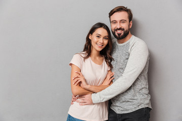 Portrait of a smiling young couple hugging