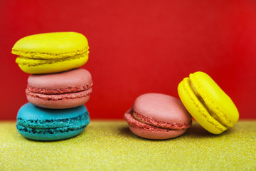 Macaroon. Macaron on red background, different bright colors