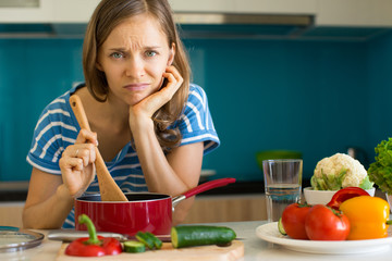 Dissatisfied Woman Cooking Dish in Sauce Pan