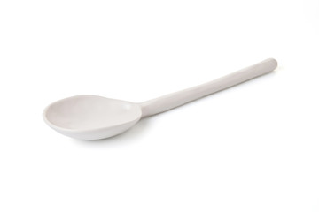white ceramic spoon on white