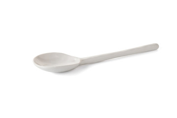 white ceramic spoon on white