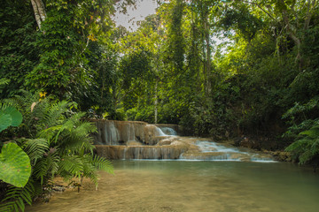 soft water of the stream in the natural park, Beautiful waterfall in rain forest