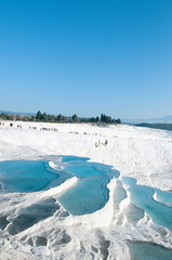 Landscape of  Travertine pools limestone terraces on bright day in Pamukkale, Denizili, Turkey