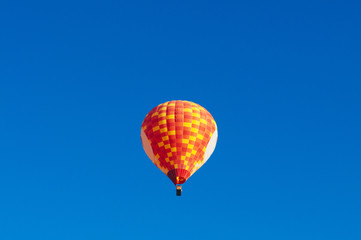 Colourful Hot air balloon floating in clear blue sky with copy space