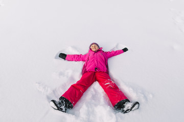 happy child in new white snow, winter  holidays