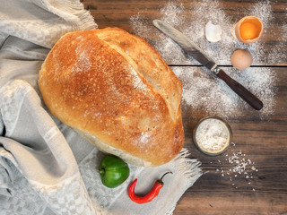 Scattered on the table flour, soup with salt, egg yolk, red pepper and green paprika. Still life...