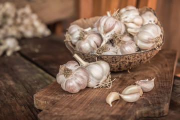 Garlic bulbs. Fresh garlic with  on wood board.