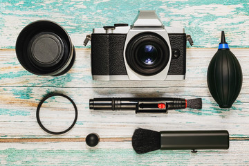 Camera with cleaning kit, flat lay
