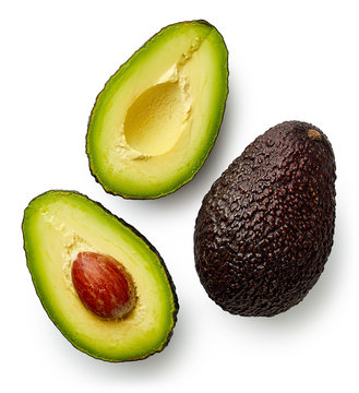 Whole and cut in half avocado
