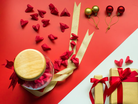 flat lay minimal concept for valentine's day and chinese new year event with lot of heart (origami)in beauty jar on red background