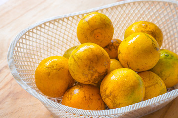 Orange in the plastic basket