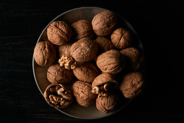 Walnuts on black background