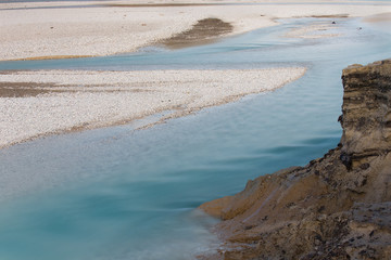 Empty accumulation lake of turquoise river Soca, Most na Soci, Slovenia, water background