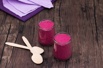 Berry smoothies in glass bowls.