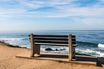 Bench facing ocean at Windansea Beach in La Jolla, California.