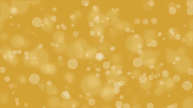 Animated golden yellow bokeh background with floating light particles.