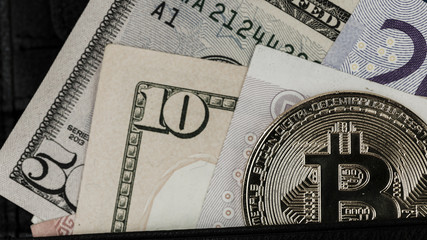 Close Up Of Bitcoin On US Dollar Banknote, Selective Focused. Electronic Money And Real Currency Exchange Concept.