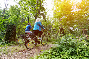 Naklejka premium Senior couple enjoying their ride in the forest.