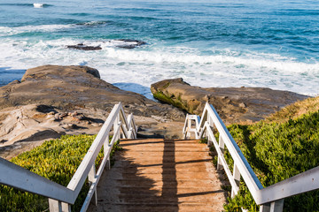 Staircase and landing for beach access to Windansea Beach in La Jolla, California. - obrazy, fototapety, plakaty