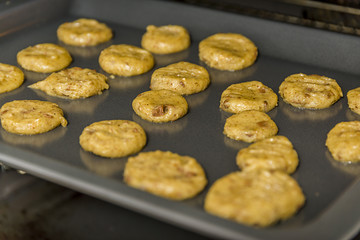 Sugar cookies baking in oven. Closeup with shallow dof.