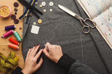 Top view on fashion designer working at messy table