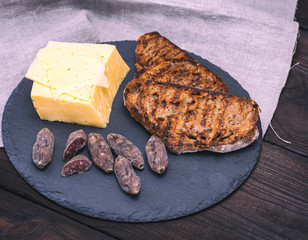 piece of cheese and two toasts of rye bread