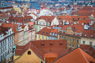 Fototapeta na wymiar Red roofs of old town of Prague in evening time, Czech Republic
