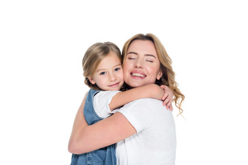 cheerful mother and daughter hugging isolated on white