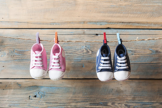 Baby Shoes Hanging On The Clothesline.