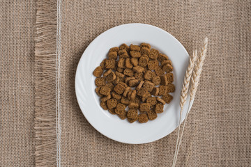 Bread rusks and croutons on a brown sackcloth surface