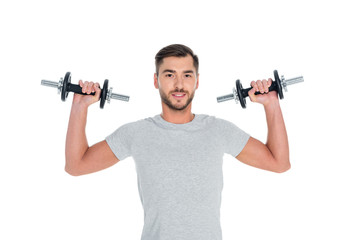 Obraz na płótnie Canvas portrait of sportsman exercising with dumbbells isolated on white