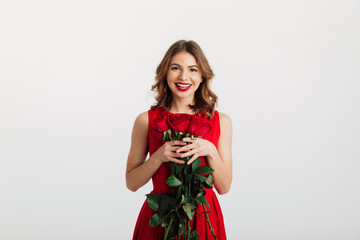 Full length portrait of a smiling young woman